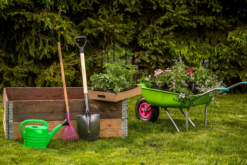 garden tools ready for landscaping with sandbags