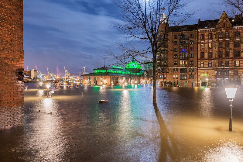 a flooded town centre at night