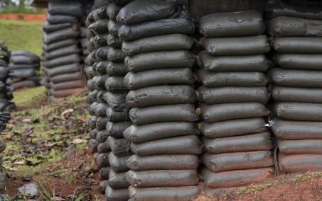 A wall build of black sandbags to protect from flooding