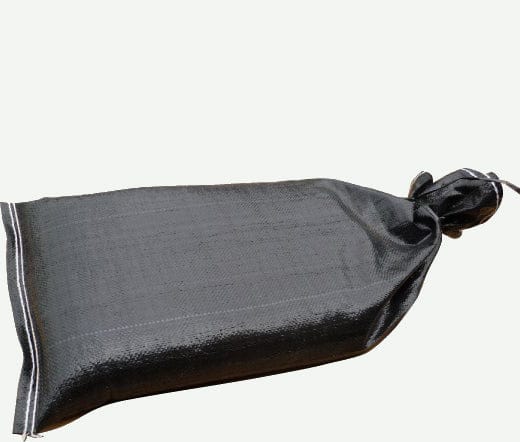 A single heavy duty UV-protected woven polypropylene black prefilled sandbag