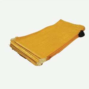 A stack of empty heavy duty woven polypropylene UV-protected beige filled sandbags