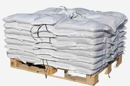 A pallet of standard white polypropylene pre-filled sandbags